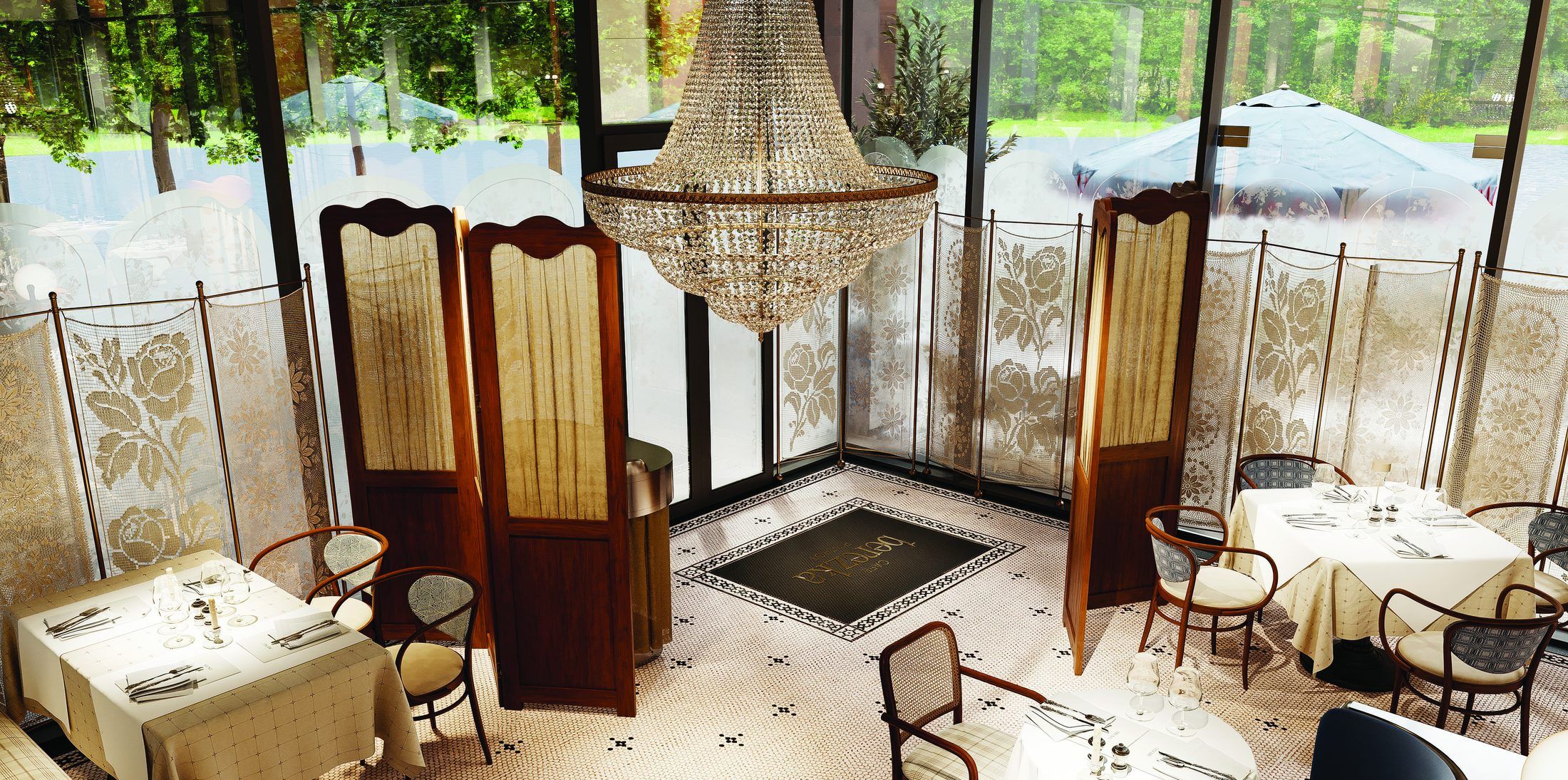 Entrance with lace screens, a crystal chandelier and the hexagon mosaic floor